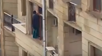 Hündürmərtəbəli binanın pəncərəsində HƏYƏCANLI ANLAR – VİDEO