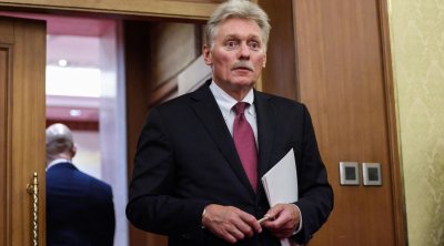 Kremldən Putinin üzü olan maskalarla bağlı suala REAKSİYA